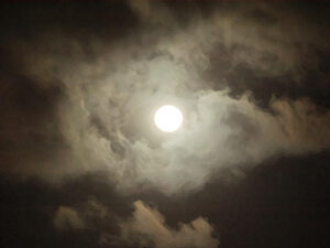 full moon in a cloudy sky